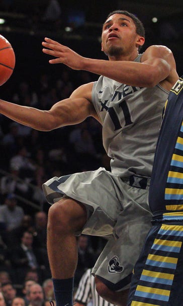 Xavier fights off Marquette, reaches Big East semifinals